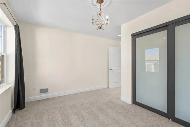 a view of a hallway with windows