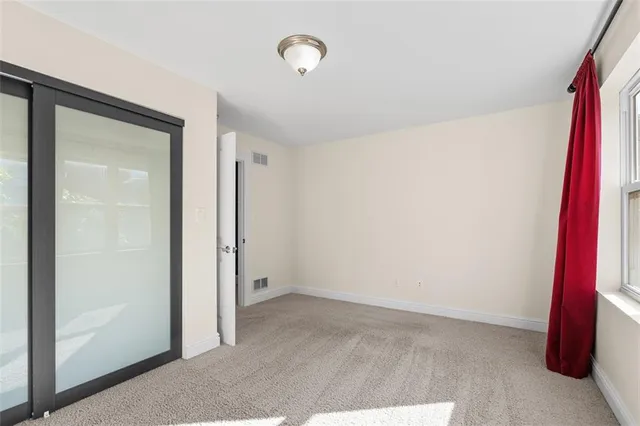 an empty room with a mirror