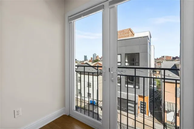 a view of a balcony and wooden floor