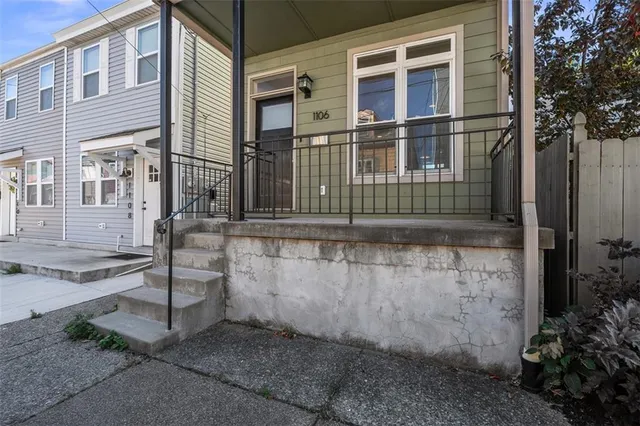front view of a house with a street