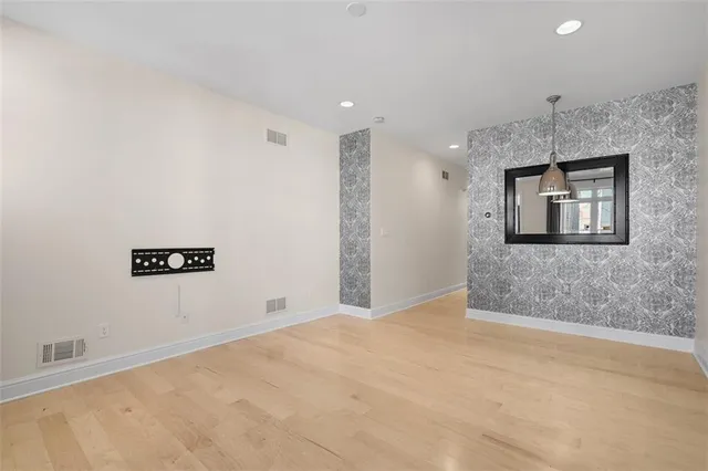 a view of a hallway with a bathroom