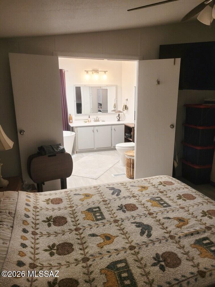 15770 North Oracle Road, Unit B4 Tucson, AZ 85739 - Photo 11 of 30 Master bedroom looking into master bath