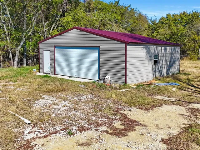 a view of a lake with houses in the background