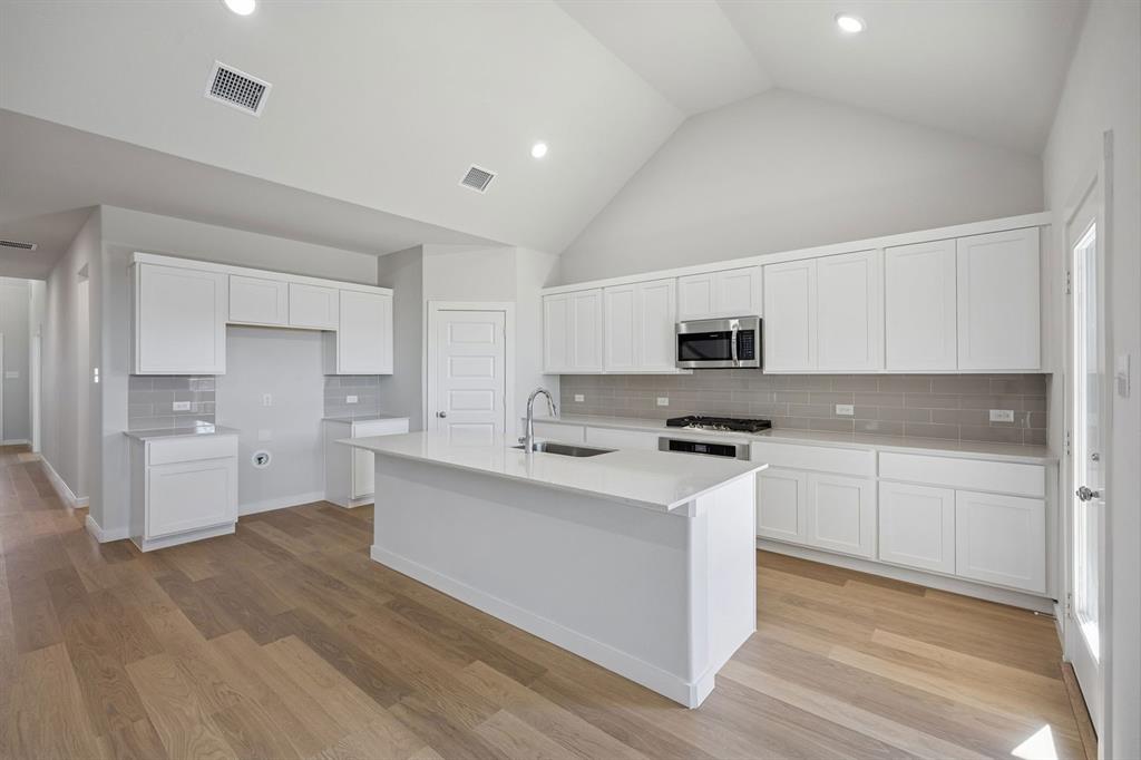 2125 Sunshining Road Princeton, TX 75407 - Photo 8 of 39 Kitchen in the Wimbledon home plan by Trophy Signature Homes – REPRESENTATIVE PHOTO