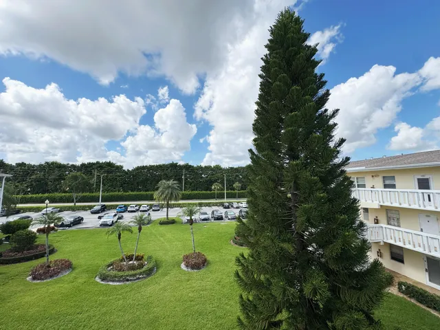 an aerial view of multiple houses with yard