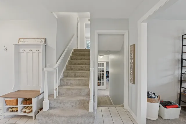 a view of an entryway with wooden floor