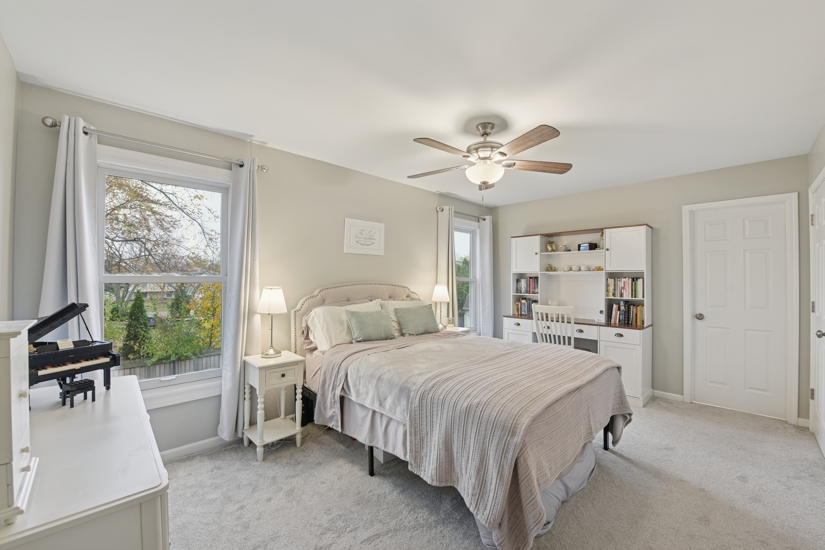 186 Ivy Lane Bloomingdale, IL 60108 - Photo 14 of 38 a bedroom with a bed and a large window with the outer view