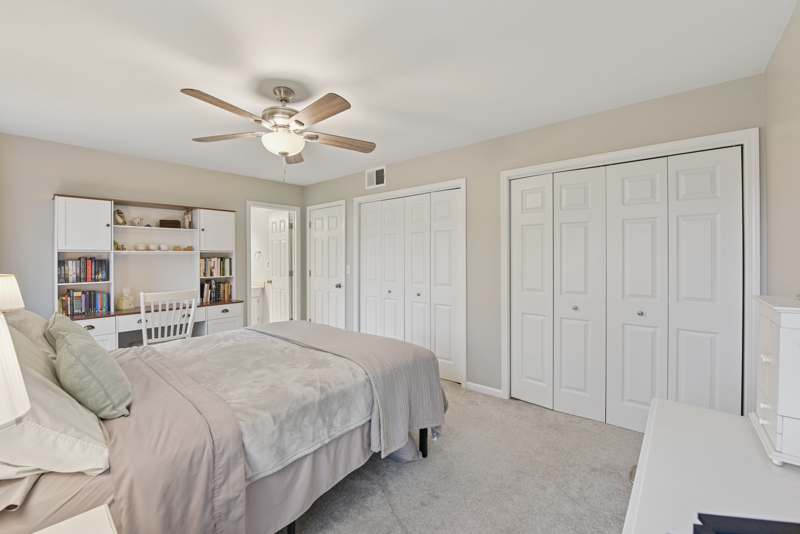 186 Ivy Lane Bloomingdale, IL 60108 - Photo 16 of 38 a bedroom with a bed and a chandelier