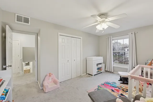 a bedroom with furniture and window