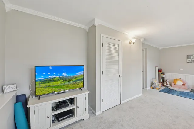 a room with furniture and flat screen tv