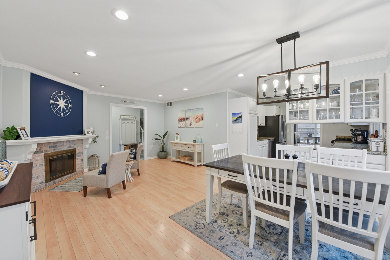 186 Ivy Lane Bloomingdale, IL 60108 - Photo 4 of 38 a living room with furniture a fireplace and a flat screen tv