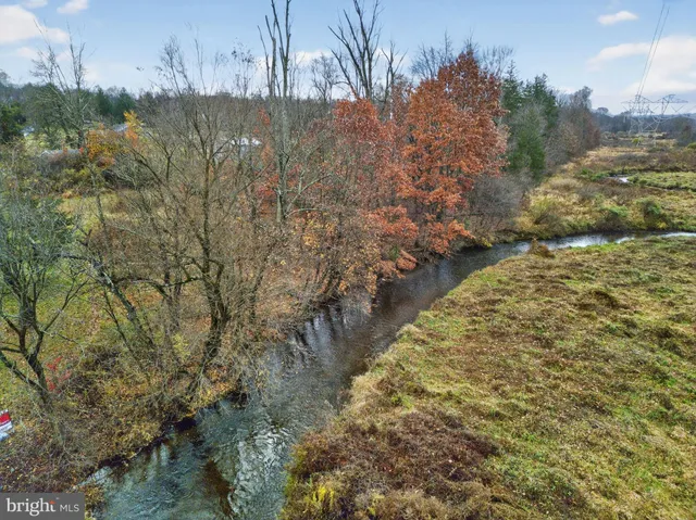a view of lake with green space