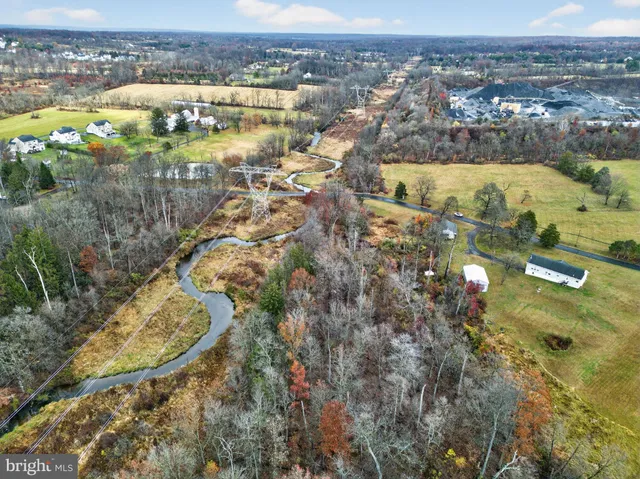 a view of swimming pool with a yard and lake