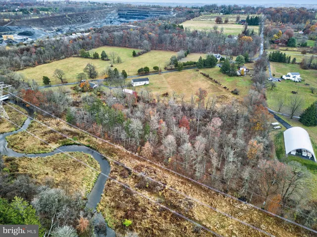 an aerial view of a houses with a lake view