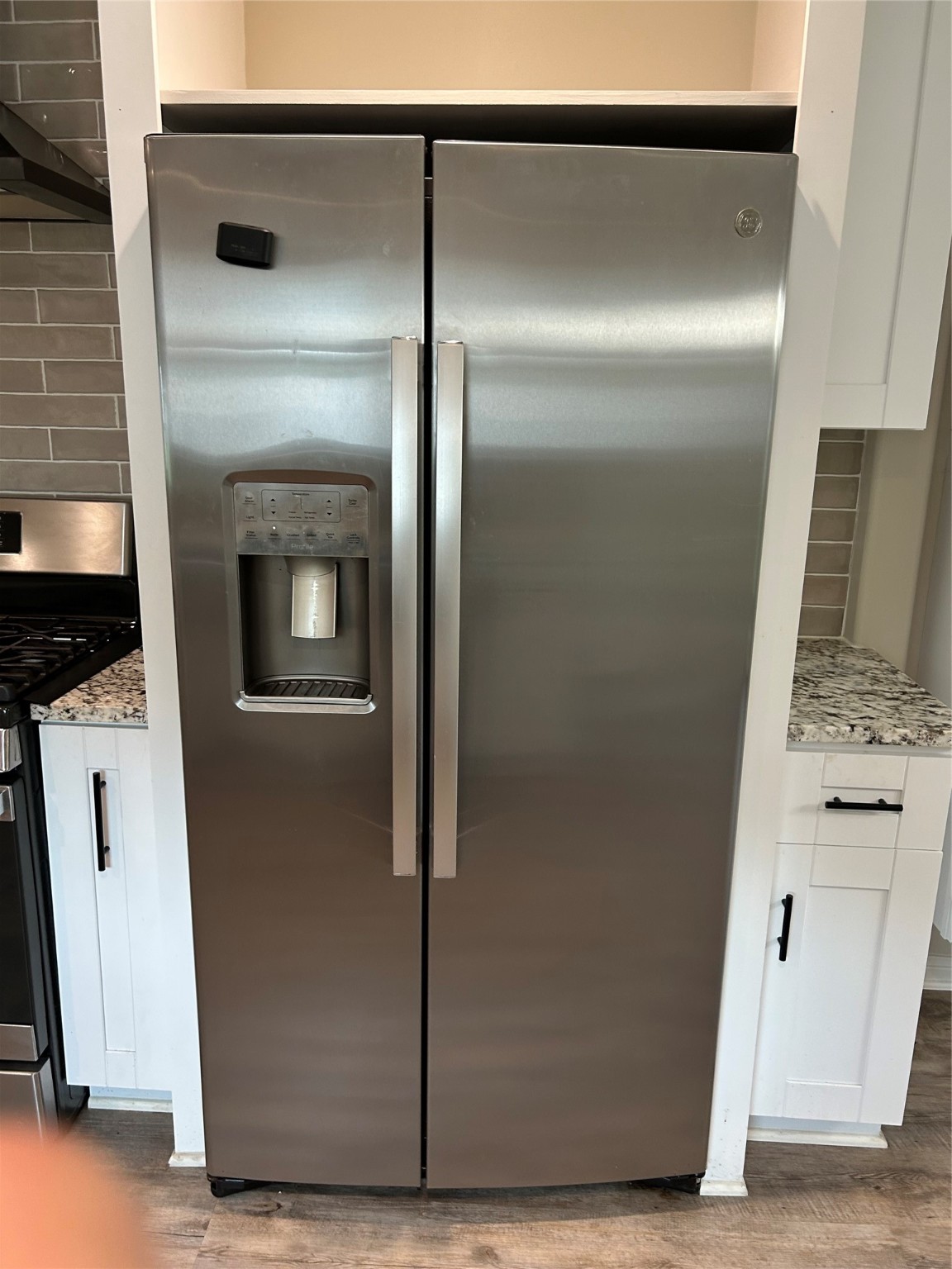 6018 Rena Street Houston, TX 77092 - Photo 14 of 28 a view of a refrigerator in kitchen and an empty room