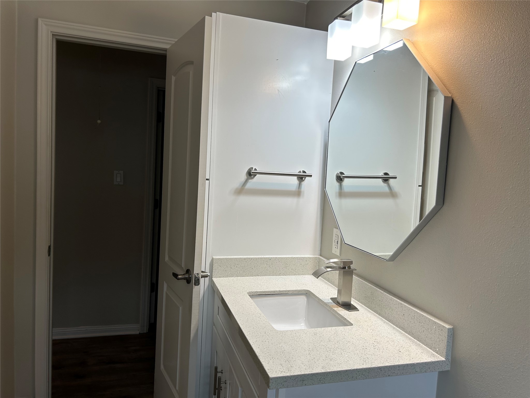 6018 Rena Street Houston, TX 77092 - Photo 20 of 28 a bathroom with a sink a mirror and a shower