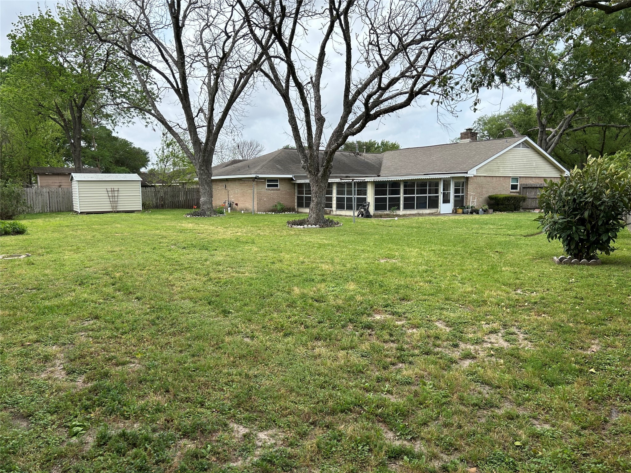 6018 Rena Street Houston, TX 77092 - Photo 26 of 28 a front view of a house with a garden