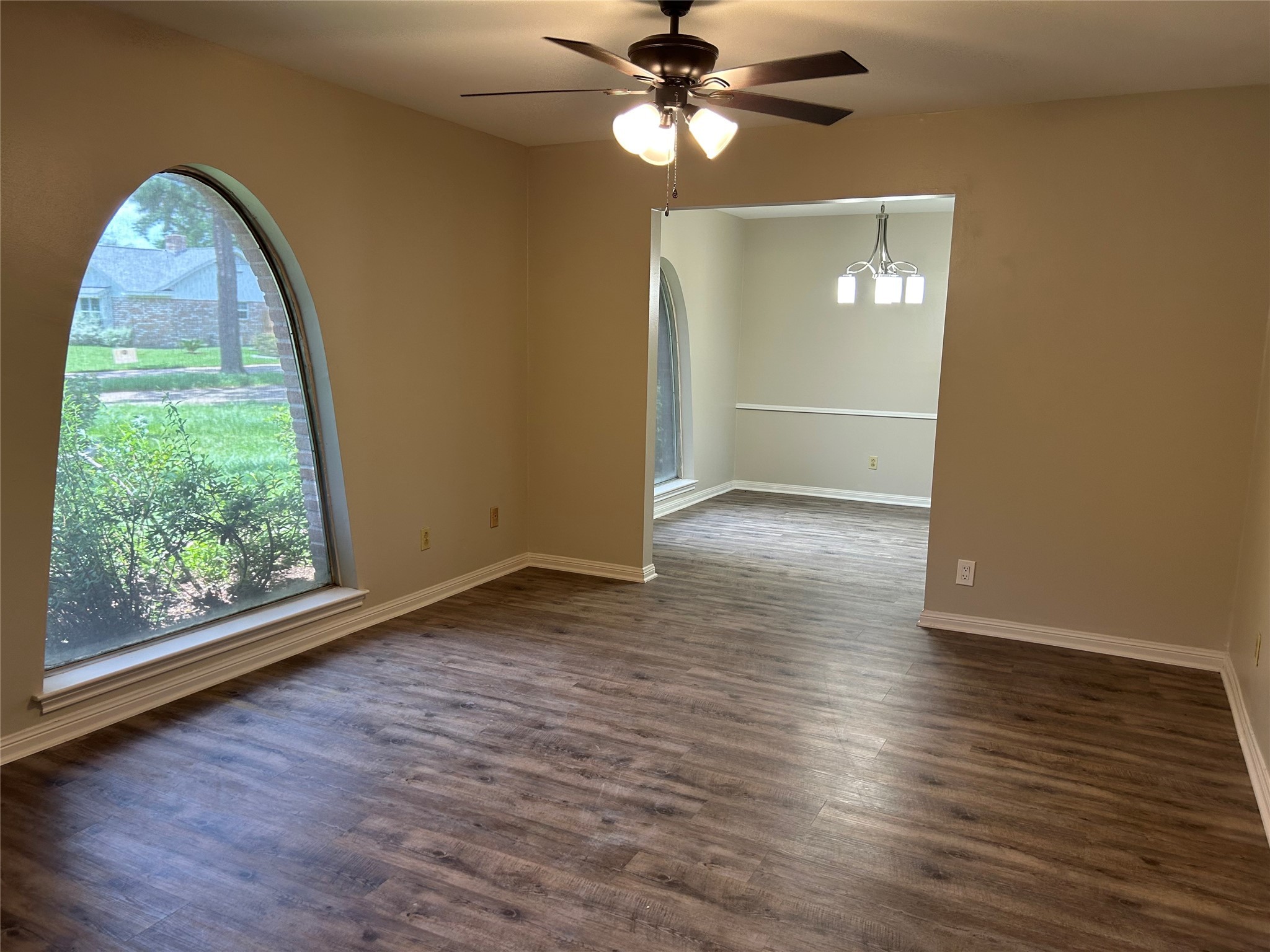 6018 Rena Street Houston, TX 77092 - Photo 7 of 28 wooden floor in an empty room with a window