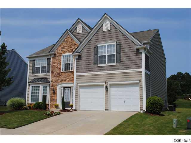 2409 Coltsgate Road Waxhaw, NC 28173 - Photo 1 of 13 a view of a yard in front of house