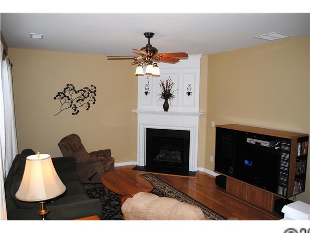 2409 Coltsgate Road Waxhaw, NC 28173 - Photo 3 of 13 a living room with furniture and a fireplace