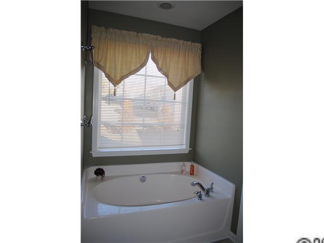 2409 Coltsgate Road Waxhaw, NC 28173 - Photo 7 of 13 a bathroom with a tub and shower