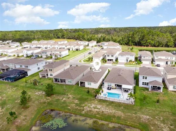 an aerial view of a house with a garden