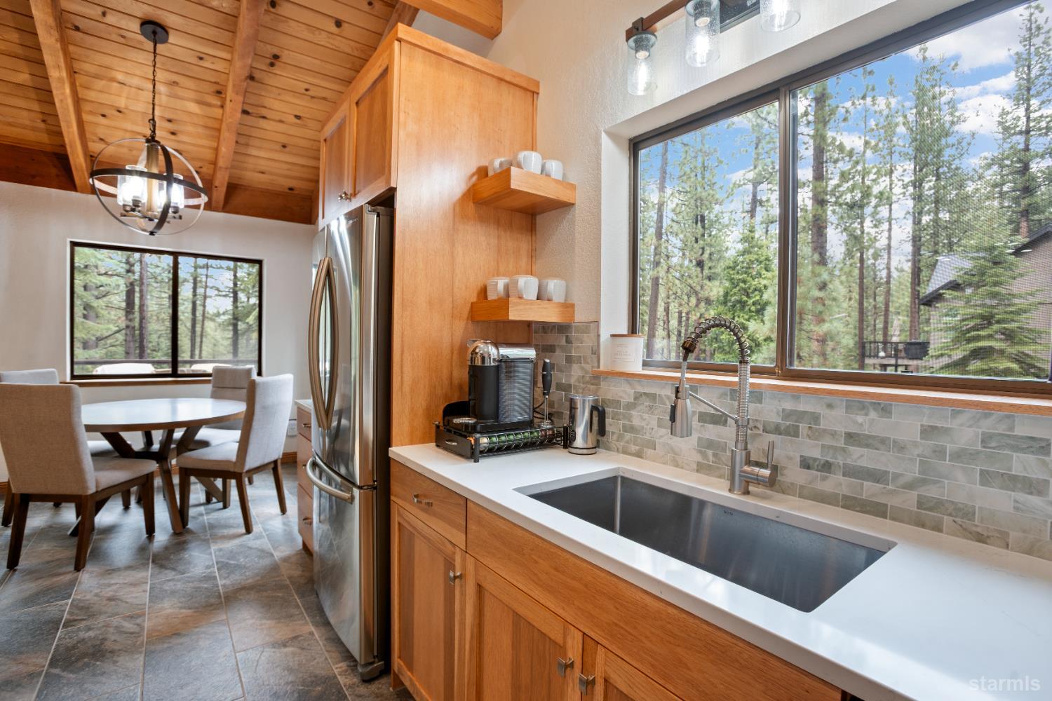 1408 Pebble Beach Road South Lake Tahoe, CA 96150 - Photo 13 of 34 a kitchen with a sink and large windows