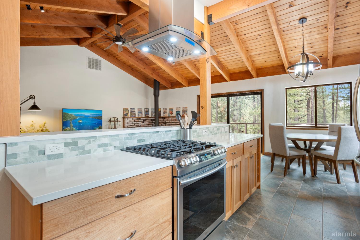 1408 Pebble Beach Road South Lake Tahoe, CA 96150 - Photo 15 of 34 a kitchen with a stove and a table
