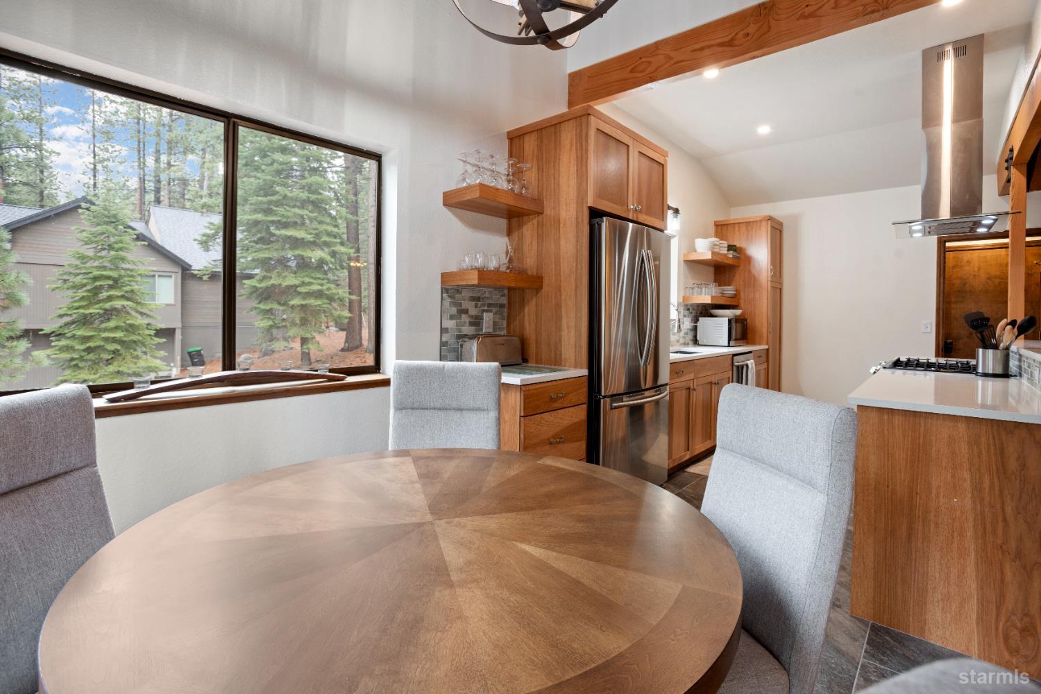 1408 Pebble Beach Road South Lake Tahoe, CA 96150 - Photo 18 of 34 a living room with furniture a large window with kitchen view