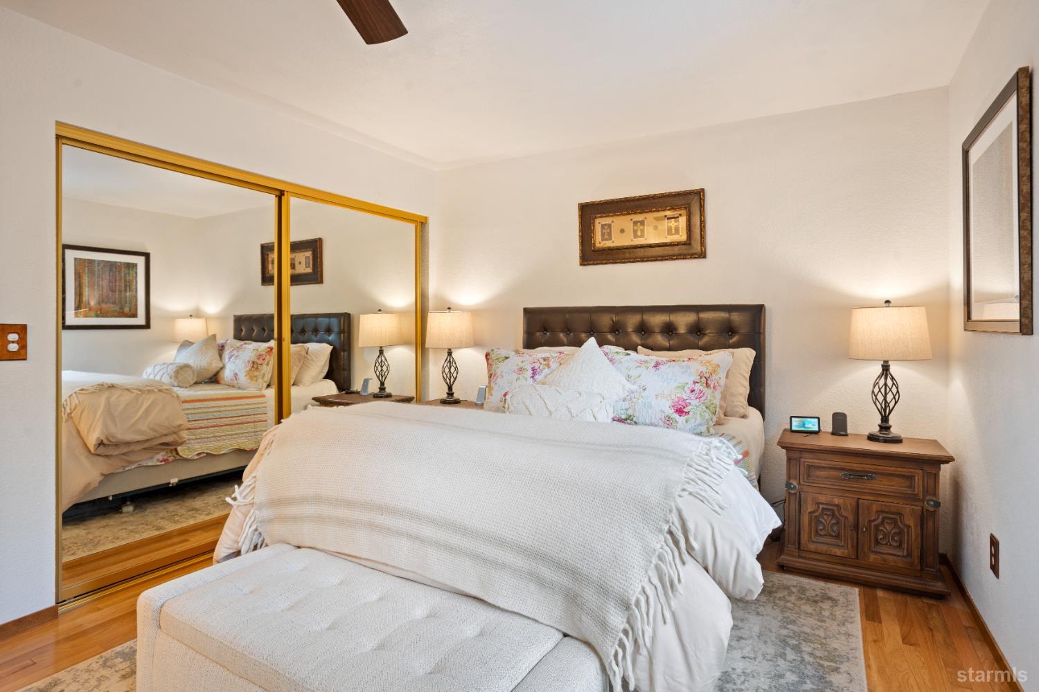 1408 Pebble Beach Road South Lake Tahoe, CA 96150 - Photo 24 of 34 a bedroom with a bed and wooden floor