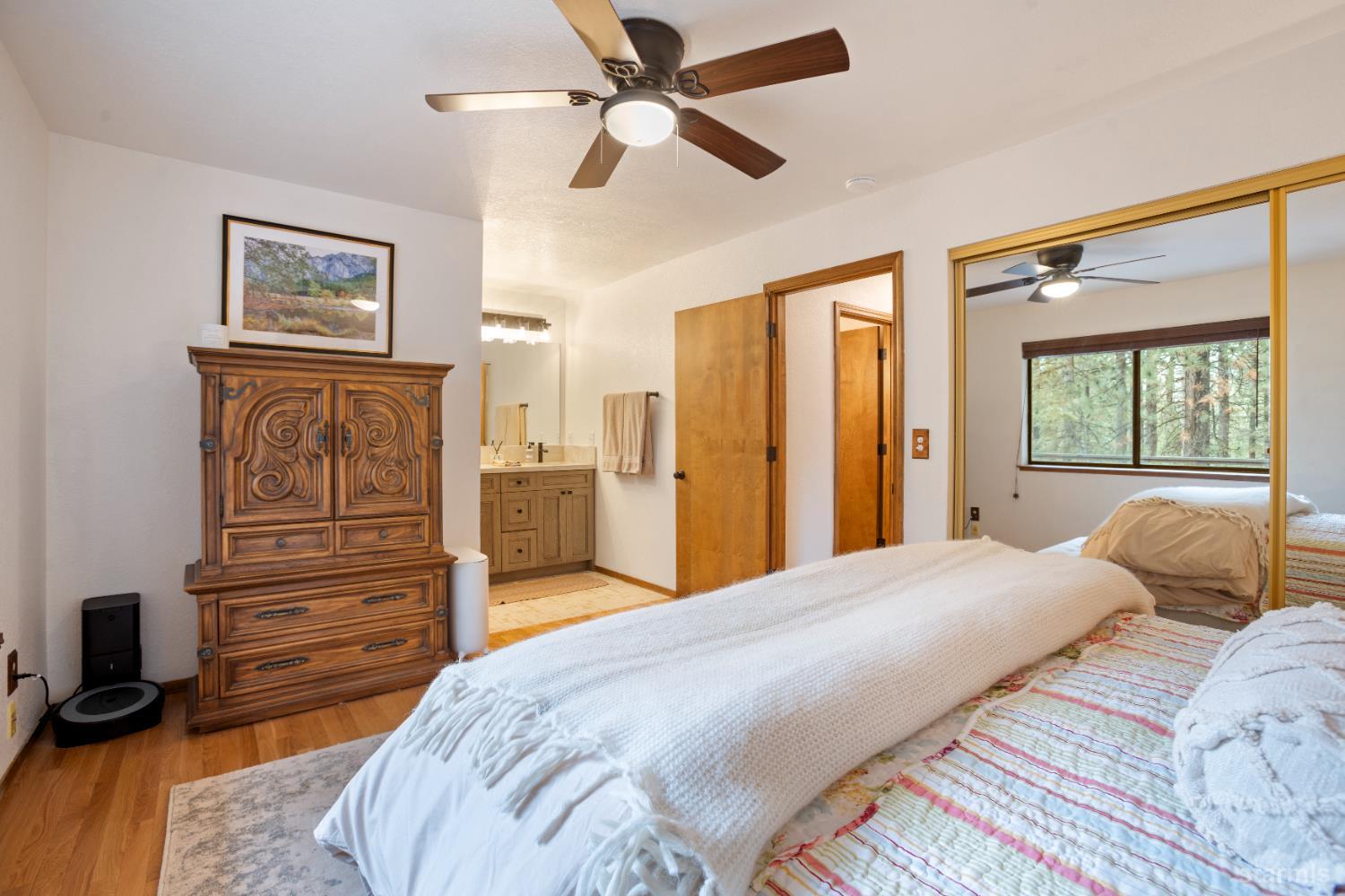 1408 Pebble Beach Road South Lake Tahoe, CA 96150 - Photo 25 of 34 a bedroom with a bed and a dresser
