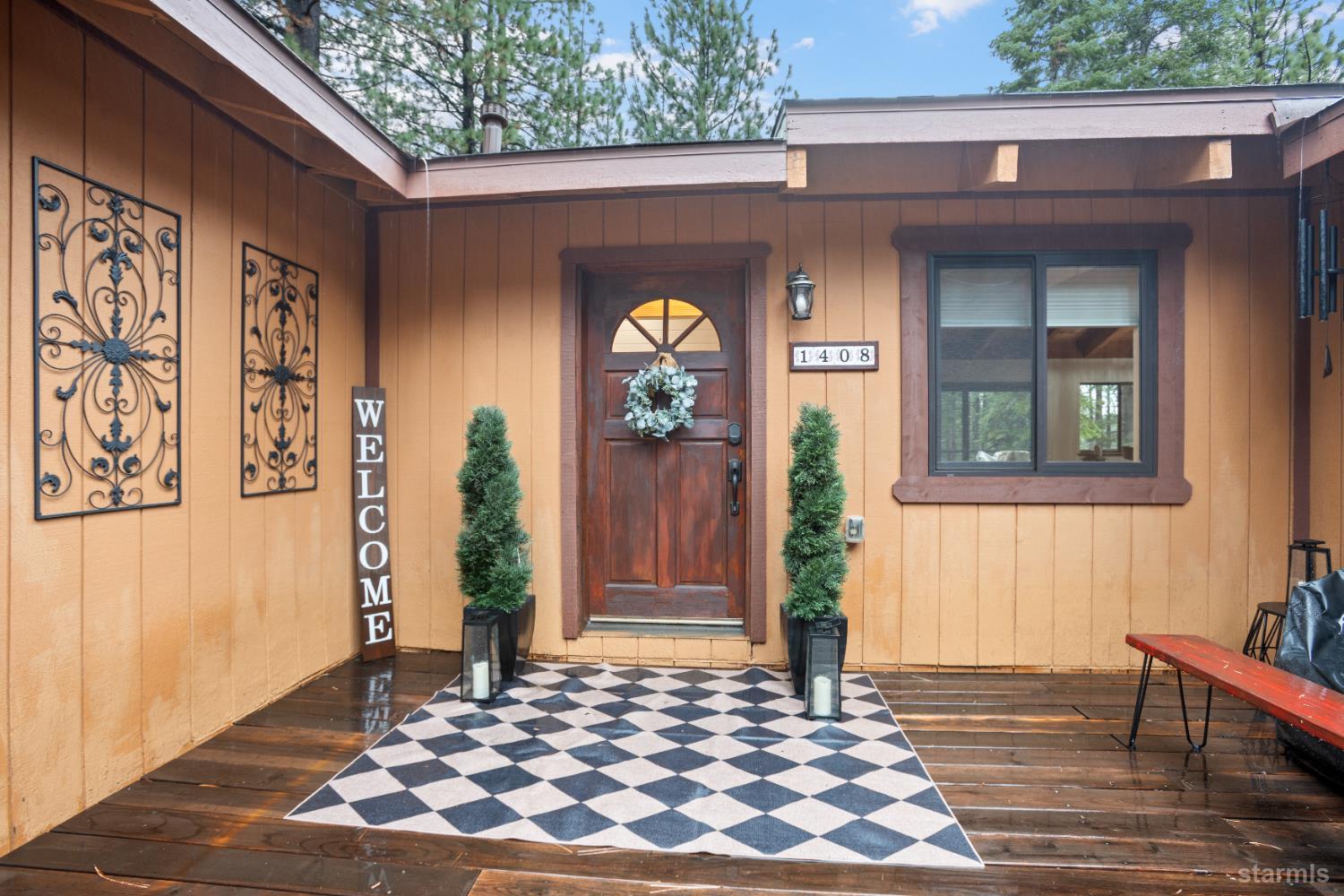 1408 Pebble Beach Road South Lake Tahoe, CA 96150 - Photo 3 of 34 a front view of a house with garden