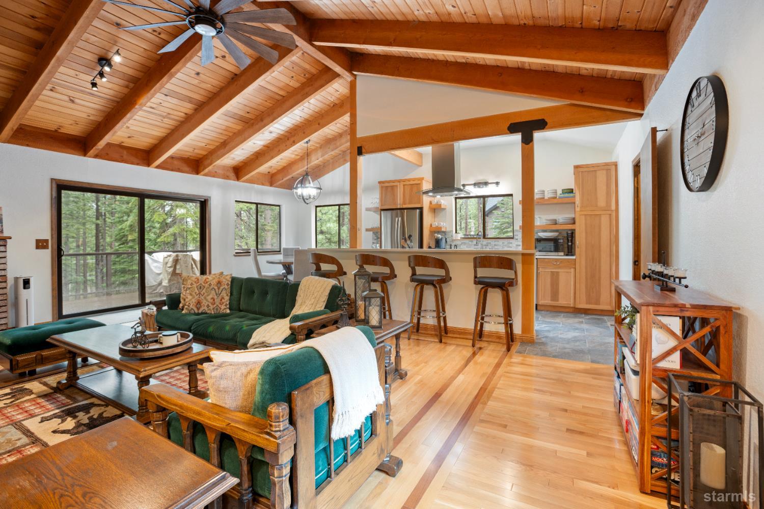 1408 Pebble Beach Road South Lake Tahoe, CA 96150 - Photo 6 of 34 a living room with furniture a rug and a floor to ceiling window