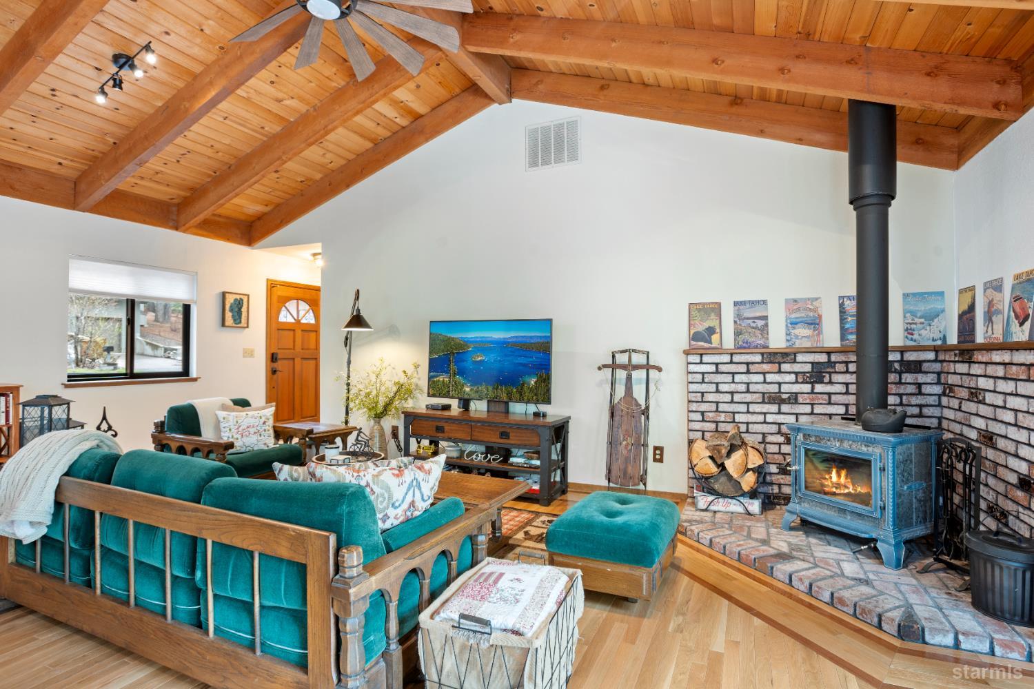 1408 Pebble Beach Road South Lake Tahoe, CA 96150 - Photo 8 of 34 a living room filled with furniture and a fireplace