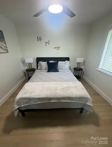 a bedroom with a bed and window