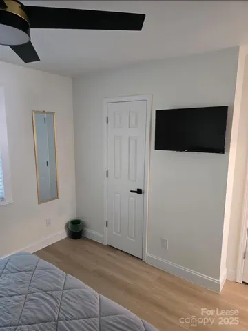 a view of a livingroom with an empty space and a hallway