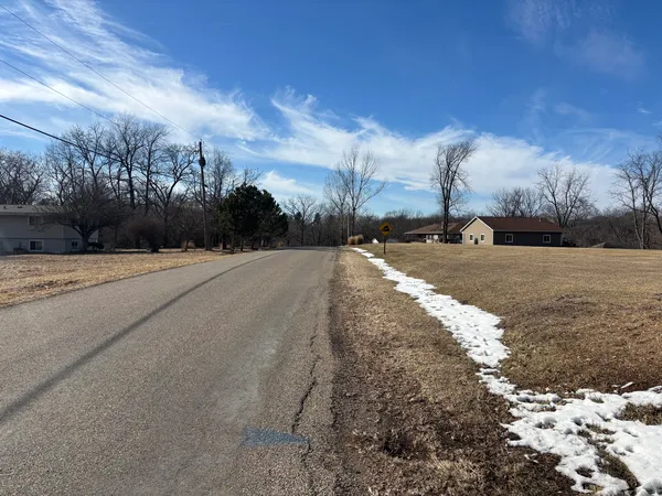 a view of a road with a yard