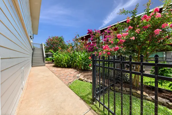 a kitchen with stainless steel appliances a refrigerator sink and stove