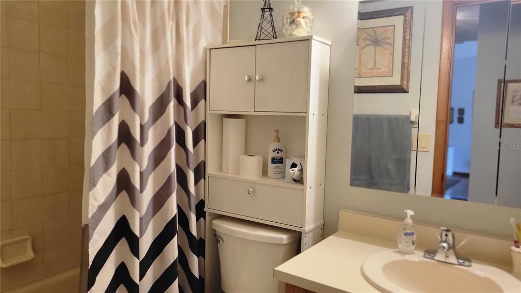 7858 Southwest 112th Lane Ocala, FL 34476 - Photo 11 of 25 a bathroom with a sink toilet and shower