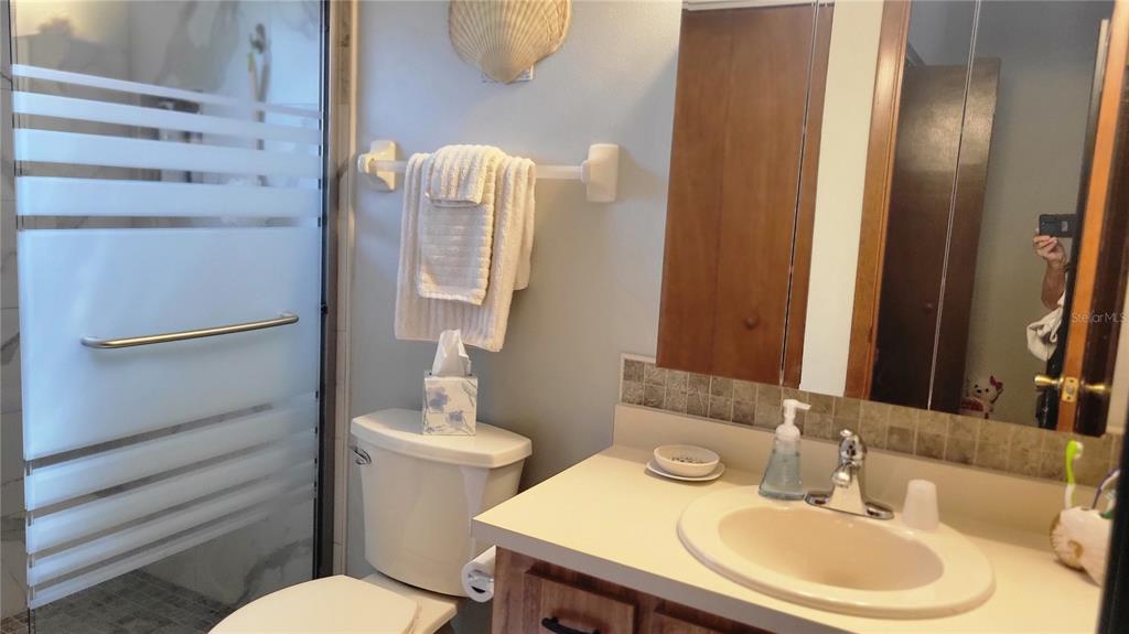 7858 Southwest 112th Lane Ocala, FL 34476 - Photo 12 of 25 a bathroom with a sink toilet and mirror
