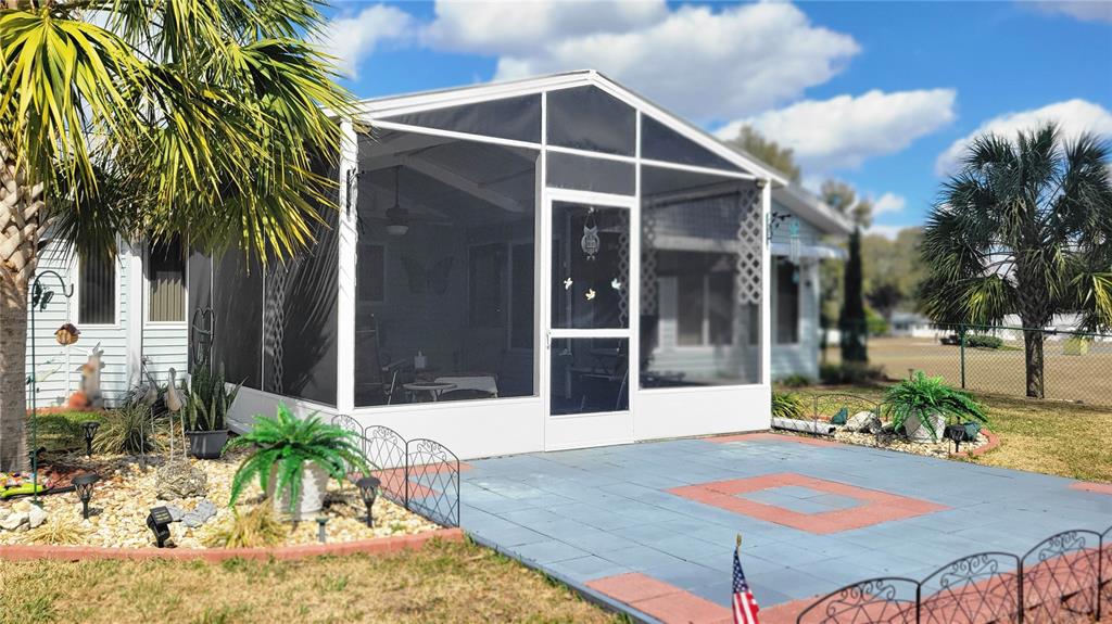 7858 Southwest 112th Lane Ocala, FL 34476 - Photo 14 of 25 a view of a house with backyard and sitting area