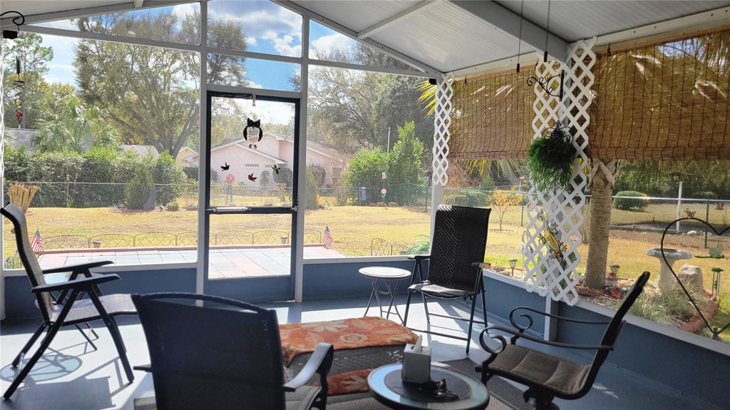 7858 Southwest 112th Lane Ocala, FL 34476 - Photo 15 of 25 a view of a dining room with furniture window and outside view