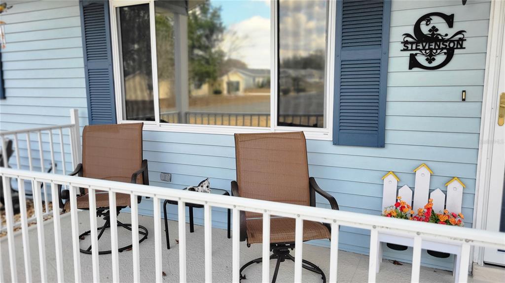 7858 Southwest 112th Lane Ocala, FL 34476 - Photo 19 of 25 a front view of a house with a porch