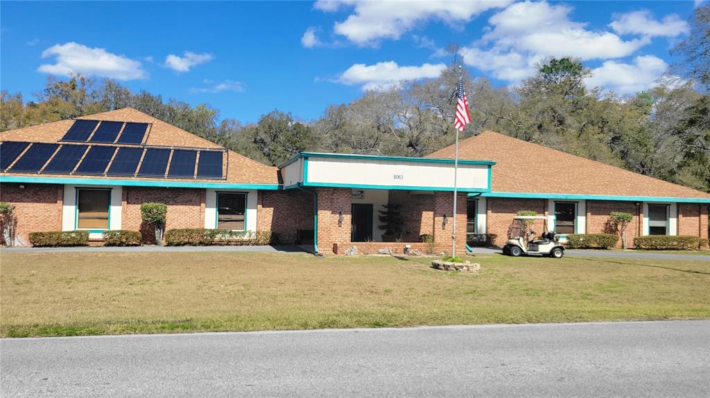 7858 Southwest 112th Lane Ocala, FL 34476 - Photo 24 of 25 a front view of a house with garden and porch
