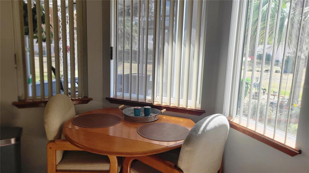 7858 Southwest 112th Lane Ocala, FL 34476 - Photo 6 of 25 a dining room with table and chairs