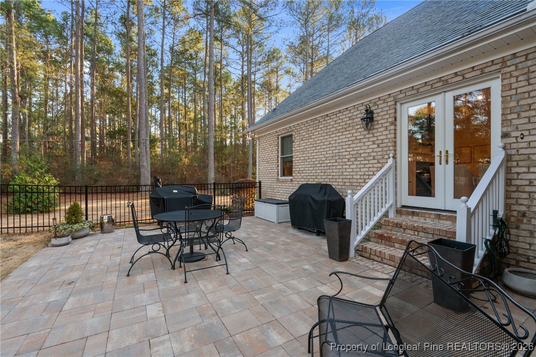 30181 East Lake Road Wagram, NC 28396 - Photo 12 of 38 a view of a patio with a table and chairs
