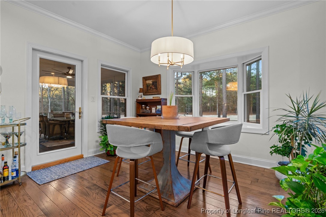 30181 East Lake Road Wagram, NC 28396 - Photo 19 of 38 a view of a dining room with furniture window and wooden floor