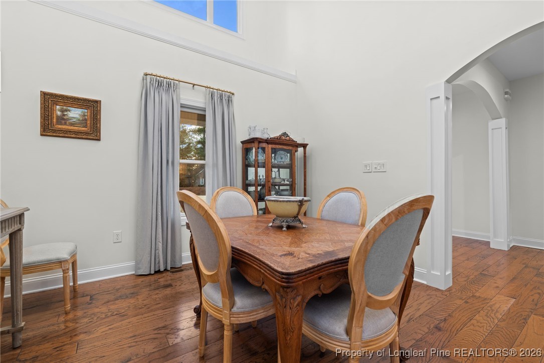 30181 East Lake Road Wagram, NC 28396 - Photo 25 of 38 a view of a dining room with furniture and wooden floor