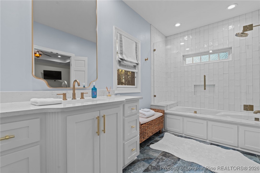 30181 East Lake Road Wagram, NC 28396 - Photo 29 of 38 a bathroom with a double vanity sink a mirror and a