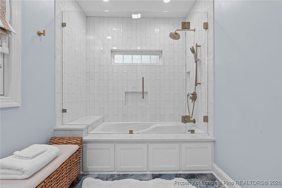 30181 East Lake Road Wagram, NC 28396 - Photo 30 of 38 a bathroom with a tub sink and mirror